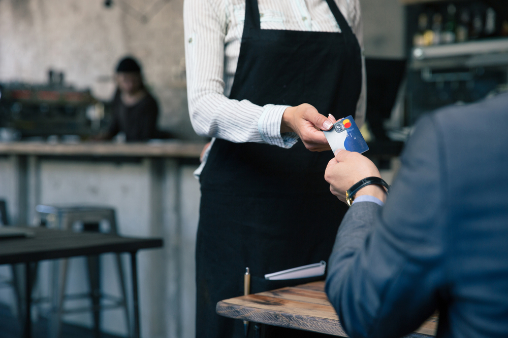 https://5565770.fs1.hubspotusercontent-na1.net/hubfs/5565770/Closeup%20image%20of%20a%20man%20giving%20credit%20card%20to%20waiter%20in%20cafe.jpeg