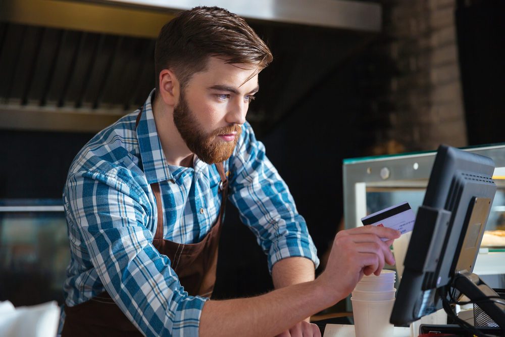 https://5565770.fs1.hubspotusercontent-na1.net/hubfs/5565770/Handsome%20concentrated%20bearded%20waiter%20swiping%20credit%20card%20through%20the%20computer%20terminal%20in%20cafe.jpeg